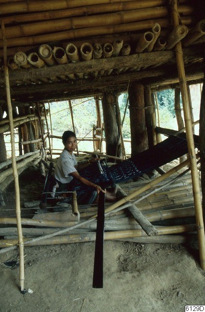 Man weaving indigo cloth