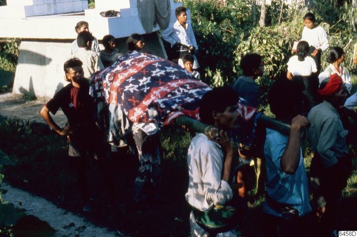 Burial procession with hinggi kombu