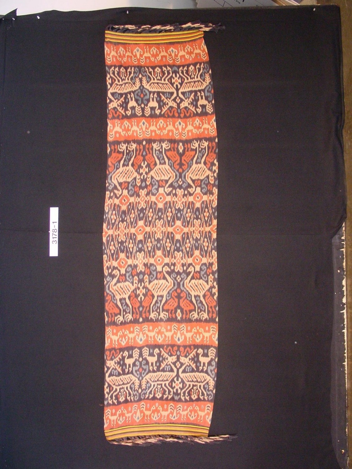 Shoulder/hip cloth with warp ikat ornament and fringe